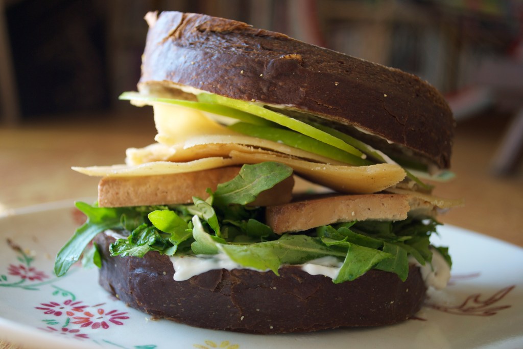 World's Best Sandwich: Green Apples, Smoked Tofu, Homemade vegan Gouda, Greens, Vegenaise, fresh Pumpernickel Bread.