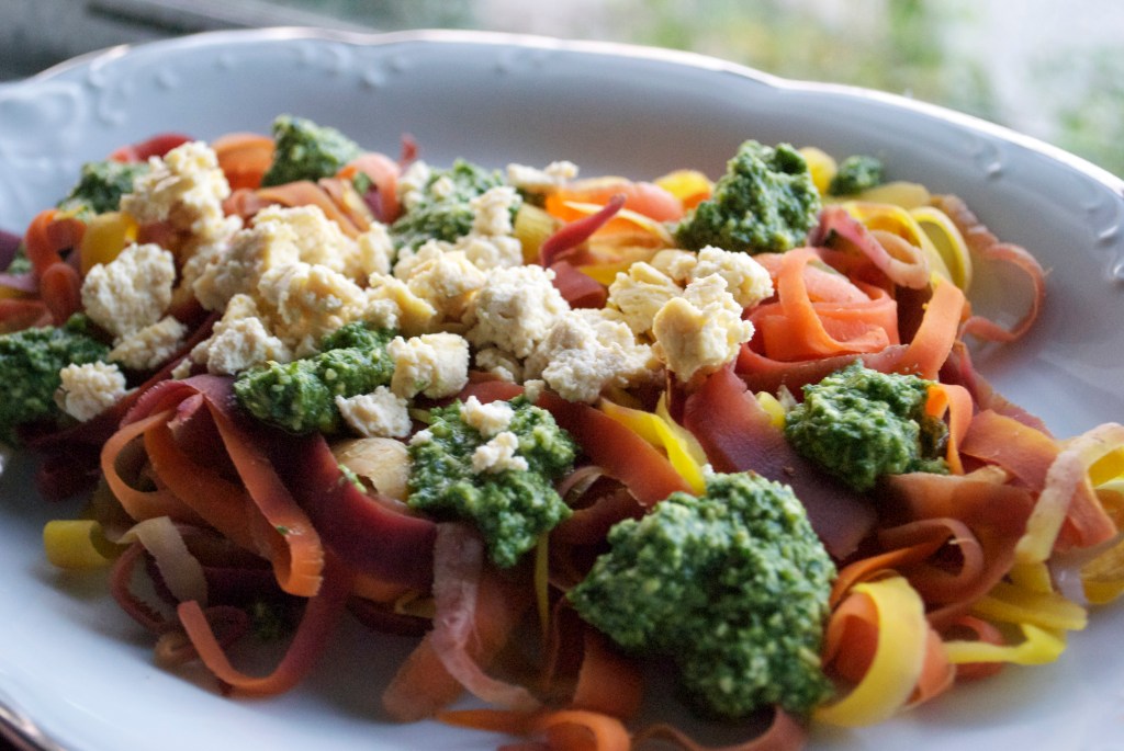 Blanched Rainbow Carrot Ribbons w/ Pesto & Tofu Goat Cheese Crumbles. 