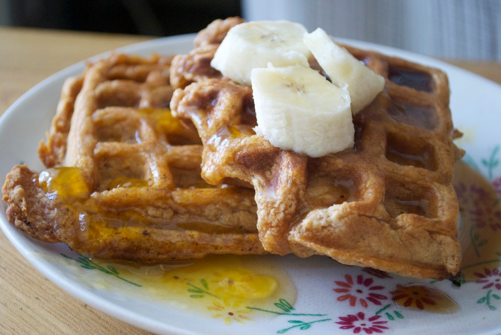 Papaya Waffles w/ Bananas, Lilikoi Syrup & Maple Syrup.